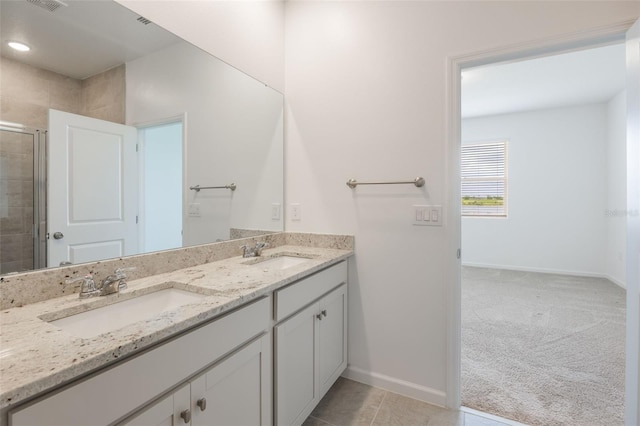 3240 Canna Lily Pl, Clermont, FL 34711 - bathroom featuring double vanity, tiled shower, and tile patterned floors