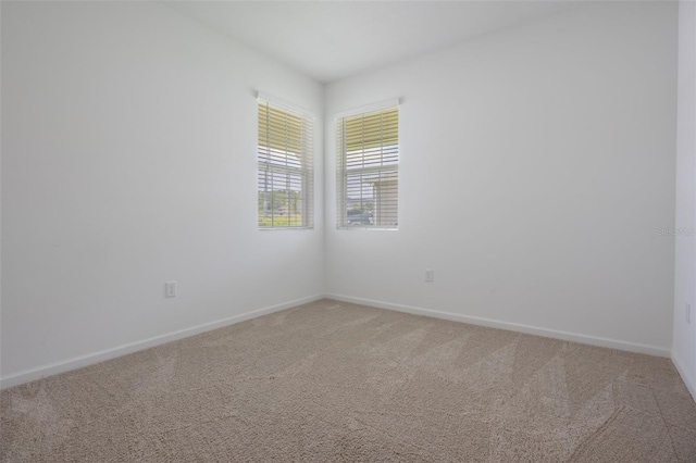 3240 Canna Lily Pl, Clermont, FL 34711 - spare room with light colored carpet and baseboards