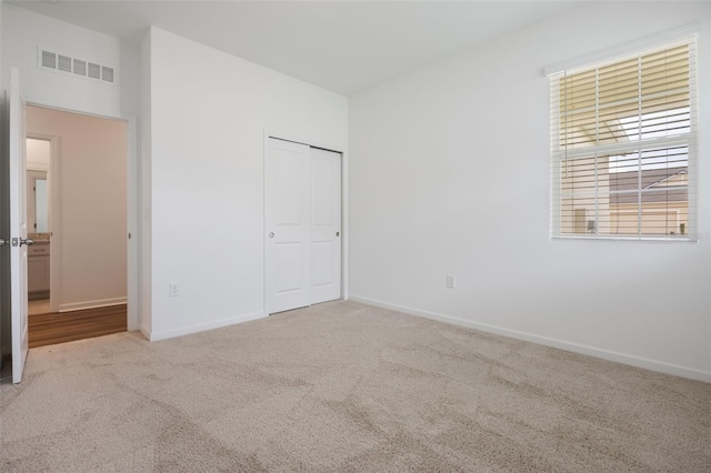 3240 Canna Lily Pl, Clermont, FL 34711 - unfurnished bedroom with carpet and a closet