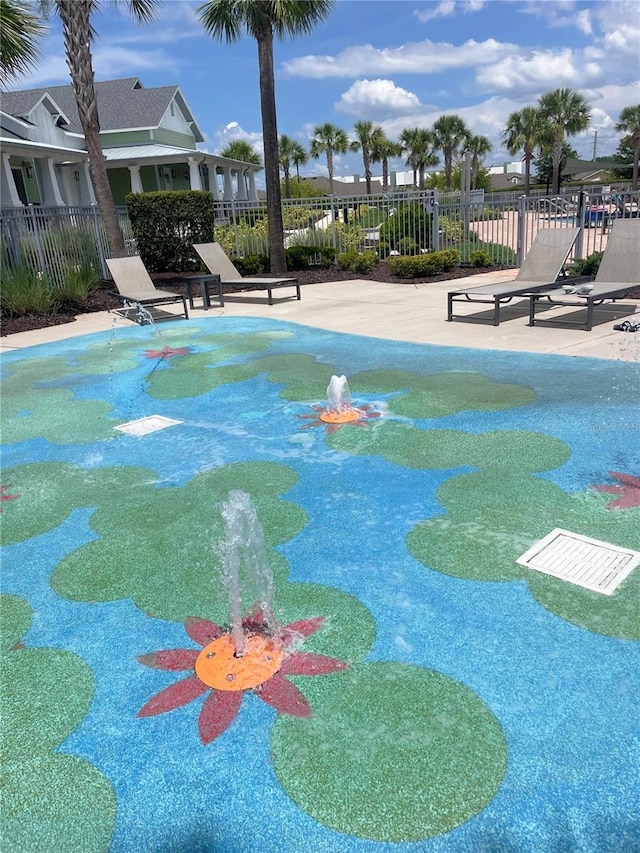 3240 Canna Lily Pl, Clermont, FL 34711 - view of community with a pool and a patio area