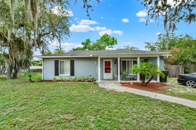 1000 Sal St, Ocoee, FL 34761 - ranch-style home with stucco siding and a porch