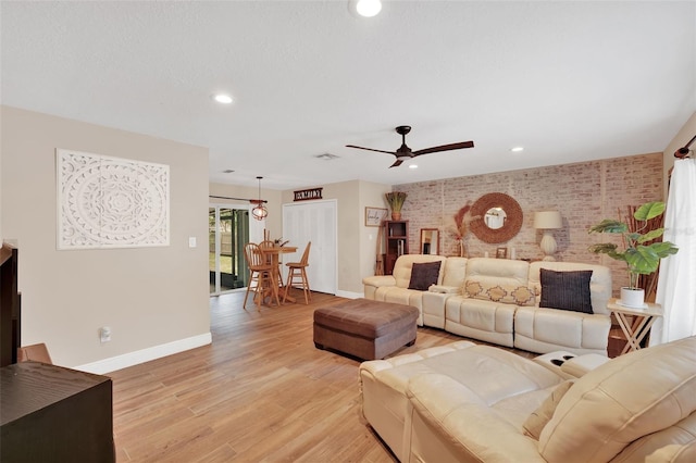 1000 Sal St, Ocoee, FL 34761 - living area featuring a ceiling fan, brick wall, light wood-style flooring, and recessed lighting