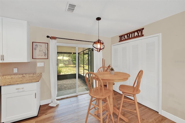 1000 Sal St, Ocoee, FL 34761 - dining room with light wood-style floors and baseboards