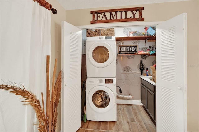 1000 Sal St, Ocoee, FL 34761 - washroom with stacked washing machine and dryer and light wood-style floors