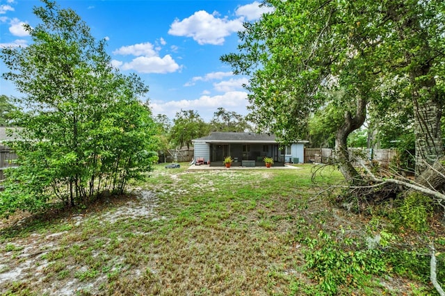 1000 Sal St, Ocoee, FL 34761 - fenced backyard featuring a sunroom