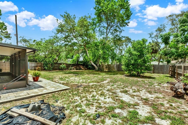 1000 Sal St, Ocoee, FL 34761 - fenced backyard with a patio area and a sunroom