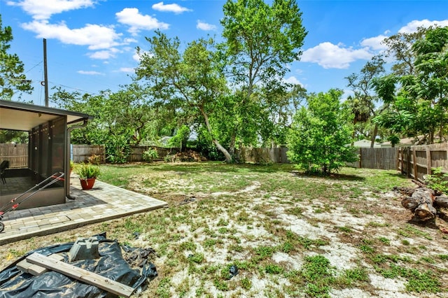 1000 Sal St, Ocoee, FL 34761 - fenced backyard with a patio and a sunroom