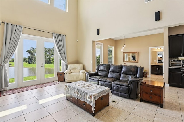 9207 Busaco Park Way, Winter Garden, FL 34787 - living area featuring a high ceiling, french doors, and light tile patterned flooring