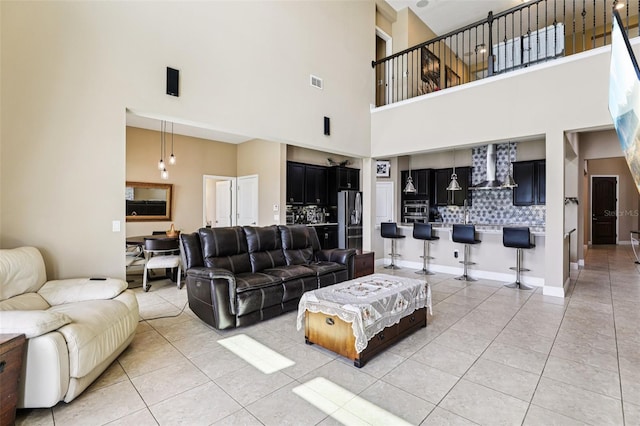 9207 Busaco Park Way, Winter Garden, FL 34787 - living room featuring a towering ceiling and light tile patterned floors