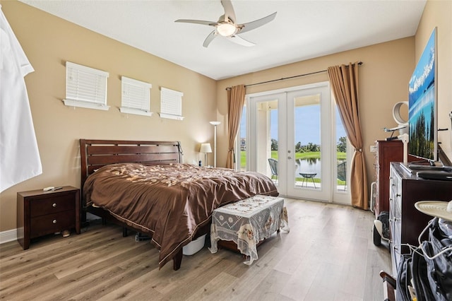 9207 Busaco Park Way, Winter Garden, FL 34787 - bedroom with french doors, access to exterior, wood finished floors, and a ceiling fan