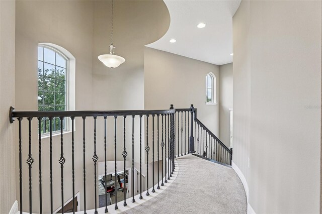 9207 Busaco Park Way, Winter Garden, FL 34787 - hall featuring an upstairs landing, carpet, and recessed lighting