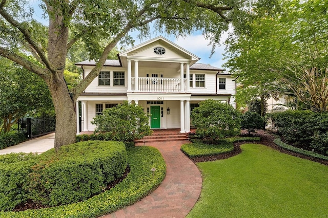 1011 Lake Davis Dr, Orlando, FL 32806 - neoclassical home with a balcony and covered porch