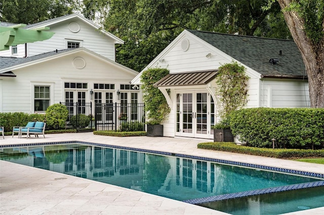 1011 Lake Davis Dr, Orlando, FL 32806 - view of pool with french doors, a patio, an outbuilding, a storage structure, and a pool with connected hot tub