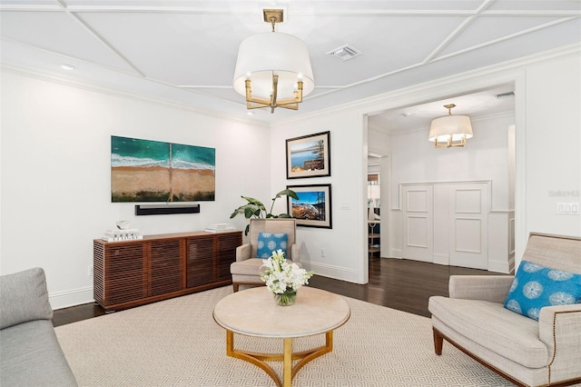 1011 Lake Davis Dr, Orlando, FL 32806 - living area with a chandelier, wood finished floors, and ornamental molding