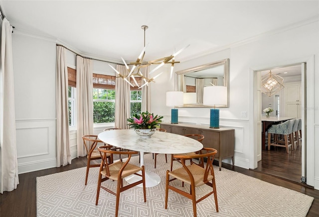 1011 Lake Davis Dr, Orlando, FL 32806 - dining area featuring a decorative wall, a chandelier, ornamental molding, dark wood-style floors, and wainscoting