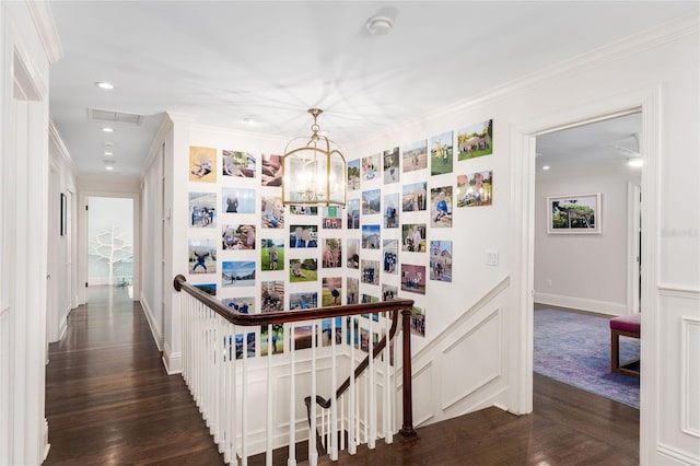 1011 Lake Davis Dr, Orlando, FL 32806 - hallway featuring an upstairs landing, a chandelier, dark wood-style floors, crown molding, and recessed lighting