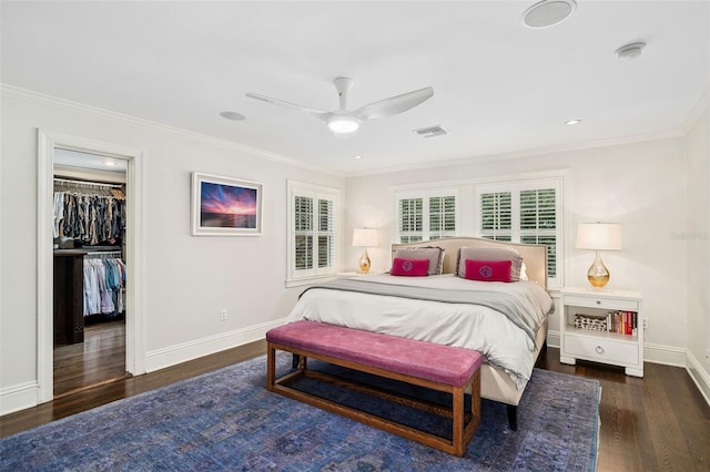 1011 Lake Davis Dr, Orlando, FL 32806 - bedroom featuring ornamental molding, wood finished floors, a spacious closet, ceiling fan, and a closet