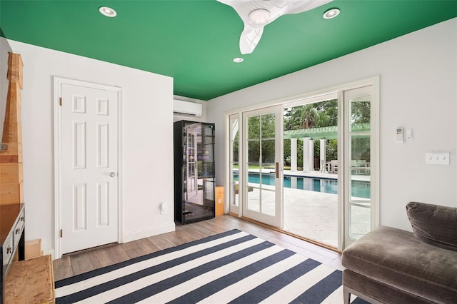 1011 Lake Davis Dr, Orlando, FL 32806 - doorway featuring a wall mounted AC, wood finished floors, and recessed lighting