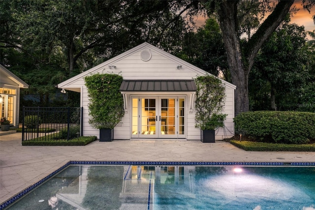 1011 Lake Davis Dr, Orlando, FL 32806 - view of pool featuring french doors, a storage structure, an outbuilding, and a patio