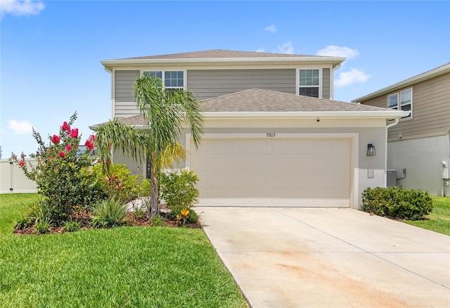 7603 Taormina Way, Clermont, FL 34714 - view of front of home with concrete driveway, a front lawn, a shingled roof, and an attached garage