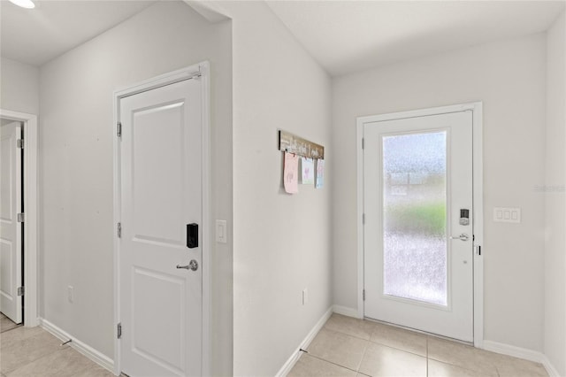 7603 Taormina Way, Clermont, FL 34714 - foyer with light tile patterned floors and baseboards