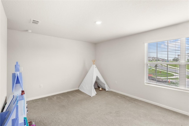 7603 Taormina Way, Clermont, FL 34714 - recreation room with light colored carpet and recessed lighting