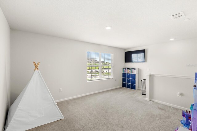 7603 Taormina Way, Clermont, FL 34714 - rec room with carpet floors and recessed lighting