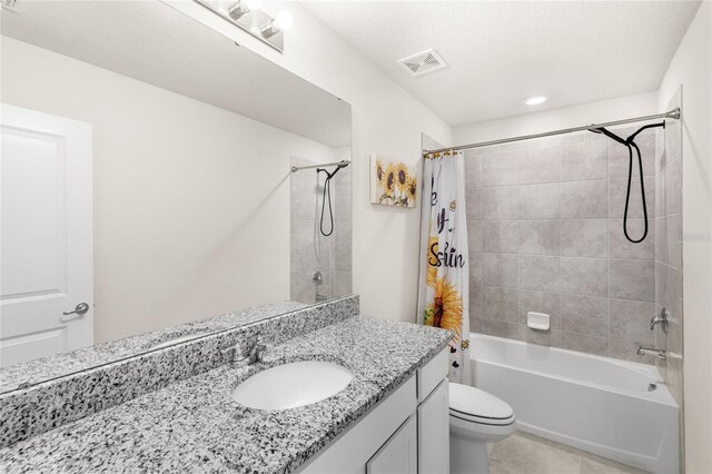 7603 Taormina Way, Clermont, FL 34714 - bathroom featuring vanity, shower / bath combo, and tile patterned flooring