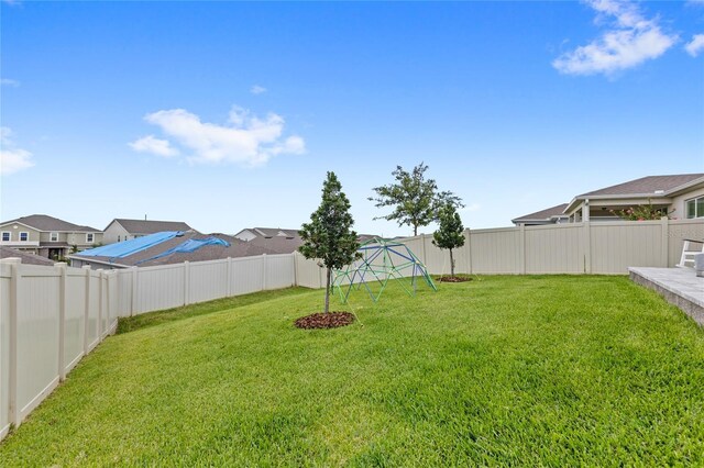 7603 Taormina Way, Clermont, FL 34714 - fenced backyard with a playground and a residential view