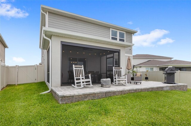 7603 Taormina Way, Clermont, FL 34714 - back of house featuring a gate, a patio, a fenced backyard, and a sunroom