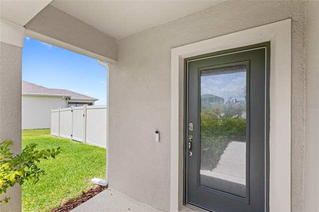 7603 Taormina Way, Clermont, FL 34714 - doorway to property with stucco siding