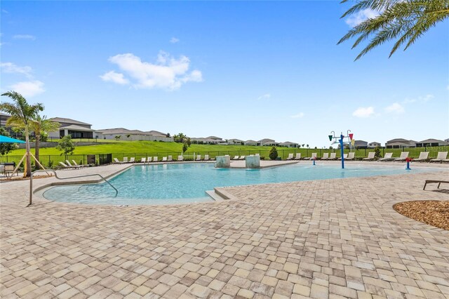 7603 Taormina Way, Clermont, FL 34714 - community pool featuring a patio area and a residential view