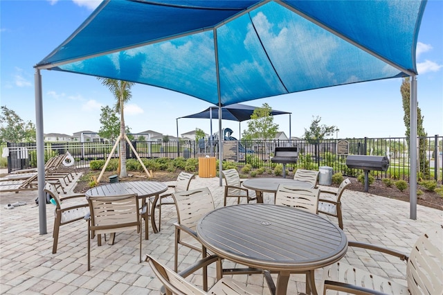 7603 Taormina Way, Clermont, FL 34714 - fenced backyard featuring a patio area and outdoor dining space