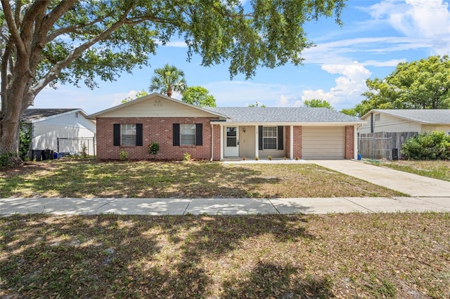 110 Rabun Ct, Sanford, FL 32773 - ranch-style house with brick siding, driveway, and an attached garage