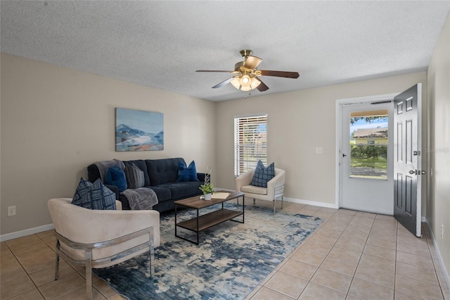 110 Rabun Ct, Sanford, FL 32773 - living room with light tile patterned floors, a ceiling fan, and a textured ceiling