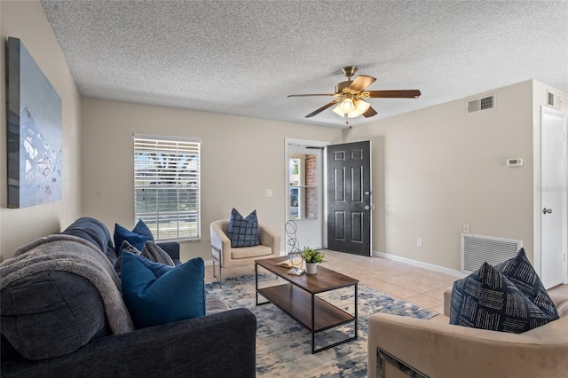 110 Rabun Ct, Sanford, FL 32773 - tiled living area with plenty of natural light, ceiling fan, and a textured ceiling