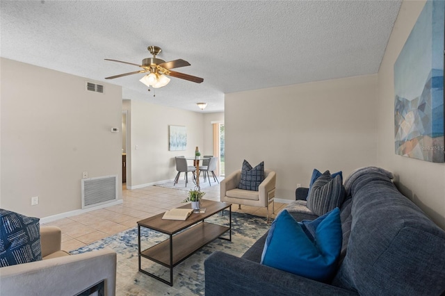 110 Rabun Ct, Sanford, FL 32773 - living area with tile patterned flooring, ceiling fan, and a textured ceiling