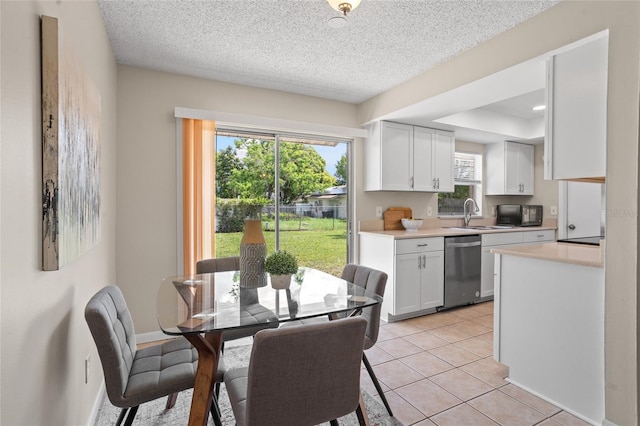 110 Rabun Ct, Sanford, FL 32773 - dining area with a textured ceiling and light tile patterned flooring