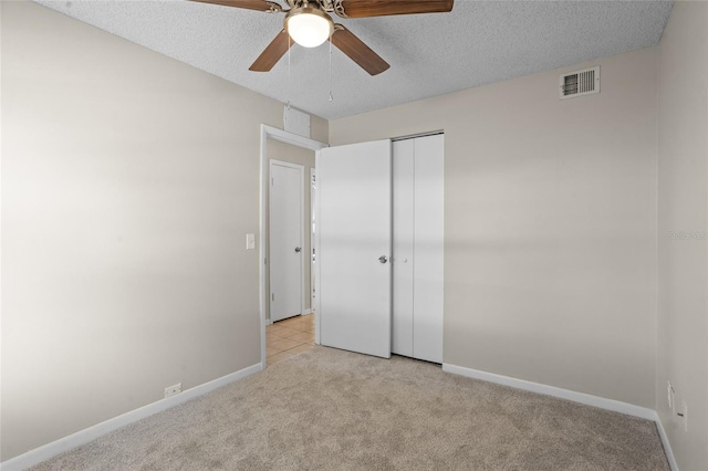 110 Rabun Ct, Sanford, FL 32773 - unfurnished bedroom featuring light carpet, a closet, a textured ceiling, and a ceiling fan