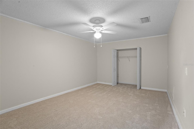 110 Rabun Ct, Sanford, FL 32773 - unfurnished bedroom featuring light carpet, a textured ceiling, a closet, crown molding, and ceiling fan