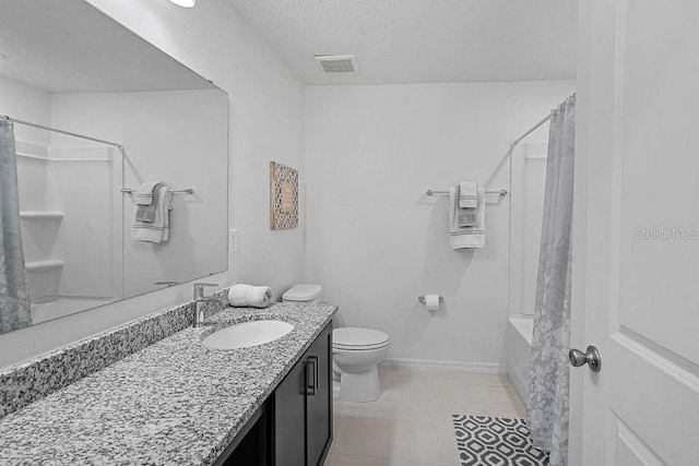 232 Summerlin Loop, Haines City, FL 33844 - bathroom featuring vanity, shower / bath combo, tile patterned floors, and a textured ceiling