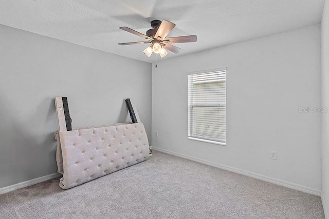 232 Summerlin Loop, Haines City, FL 33844 - unfurnished bedroom with carpet, ceiling fan, and a textured ceiling