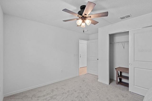 232 Summerlin Loop, Haines City, FL 33844 - unfurnished bedroom with carpet floors, a closet, and a ceiling fan
