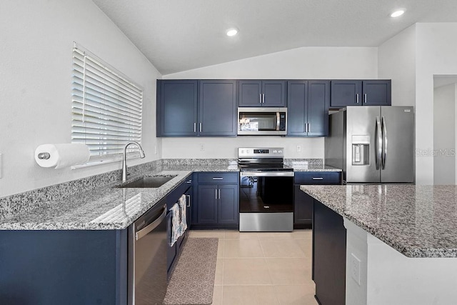 232 Summerlin Loop, Haines City, FL 33844 - kitchen featuring stainless steel appliances, light stone countertops, vaulted ceiling, light tile patterned floors, and recessed lighting
