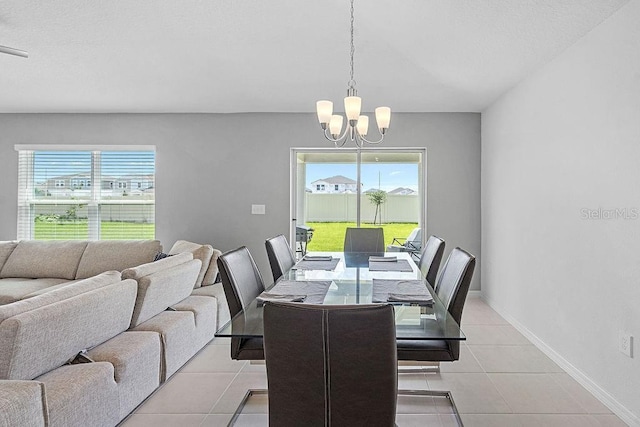 232 Summerlin Loop, Haines City, FL 33844 - dining room with a chandelier, plenty of natural light, and light tile patterned floors