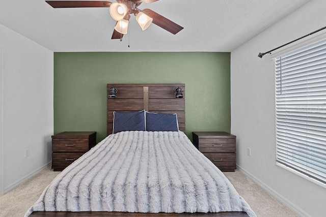 232 Summerlin Loop, Haines City, FL 33844 - carpeted bedroom with baseboards and ceiling fan