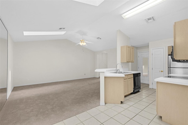 2404 SW 20th Ter, Ocala, FL 34471 - kitchen featuring dishwasher, a skylight, open floor plan, light brown cabinets, and vaulted ceiling