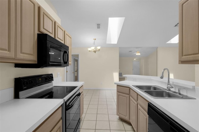 2404 SW 20th Ter, Ocala, FL 34471 - kitchen with black appliances, light brown cabinetry, a skylight, a chandelier, and light countertops