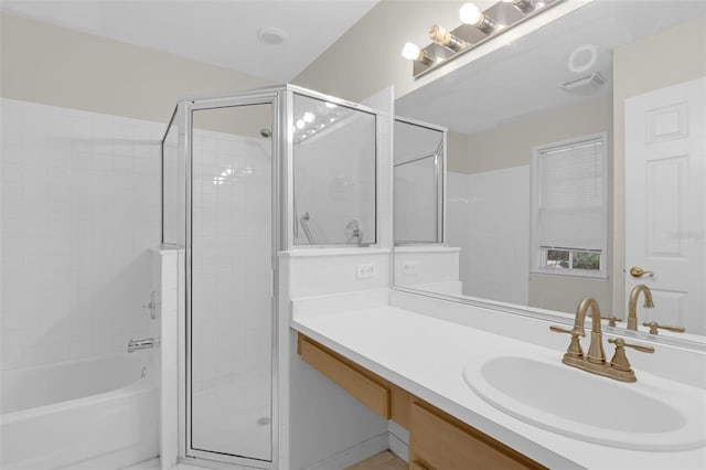2404 SW 20th Ter, Ocala, FL 34471 - full bathroom featuring a shower with shower door, vanity, and a bathtub