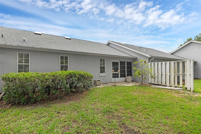 2404 SW 20th Ter, Ocala, FL 34471 - rear view of house with stucco siding and a shingled roof
